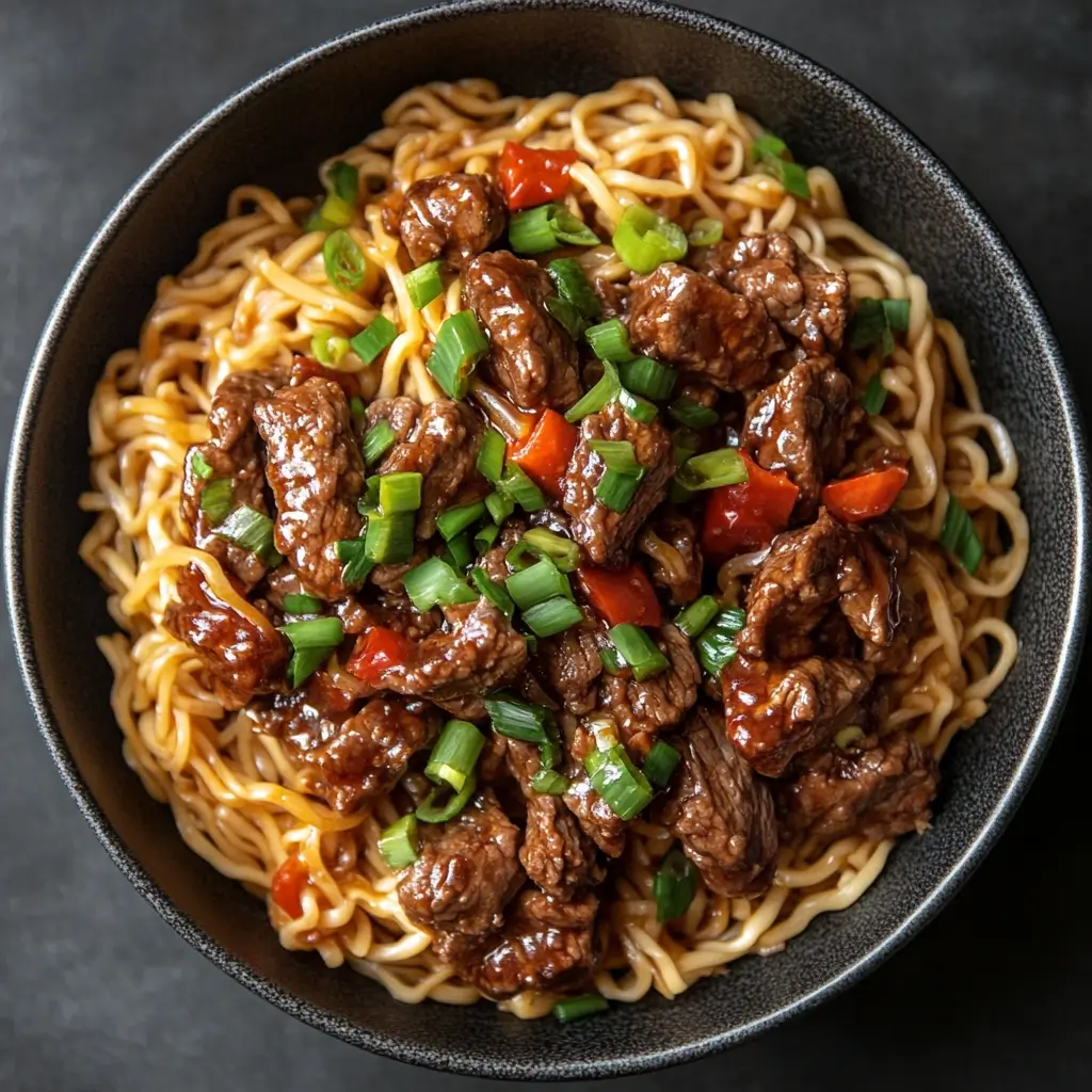 Delicious Hoisin Beef Noodles with tender beef, crisp vegetables, and hoisin sauce on a bed of noodles.